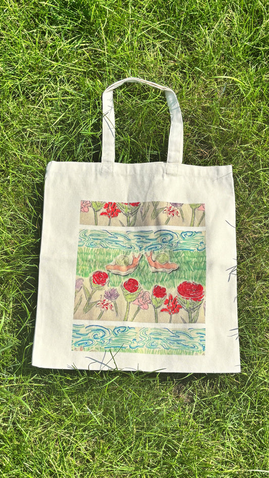 two snails in a garden tote bag